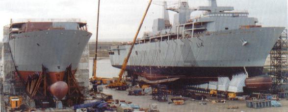 HMS Albion L14 next to HMS Bulwark L15, prior to the former being launched. Click on image for cutaway diagram.